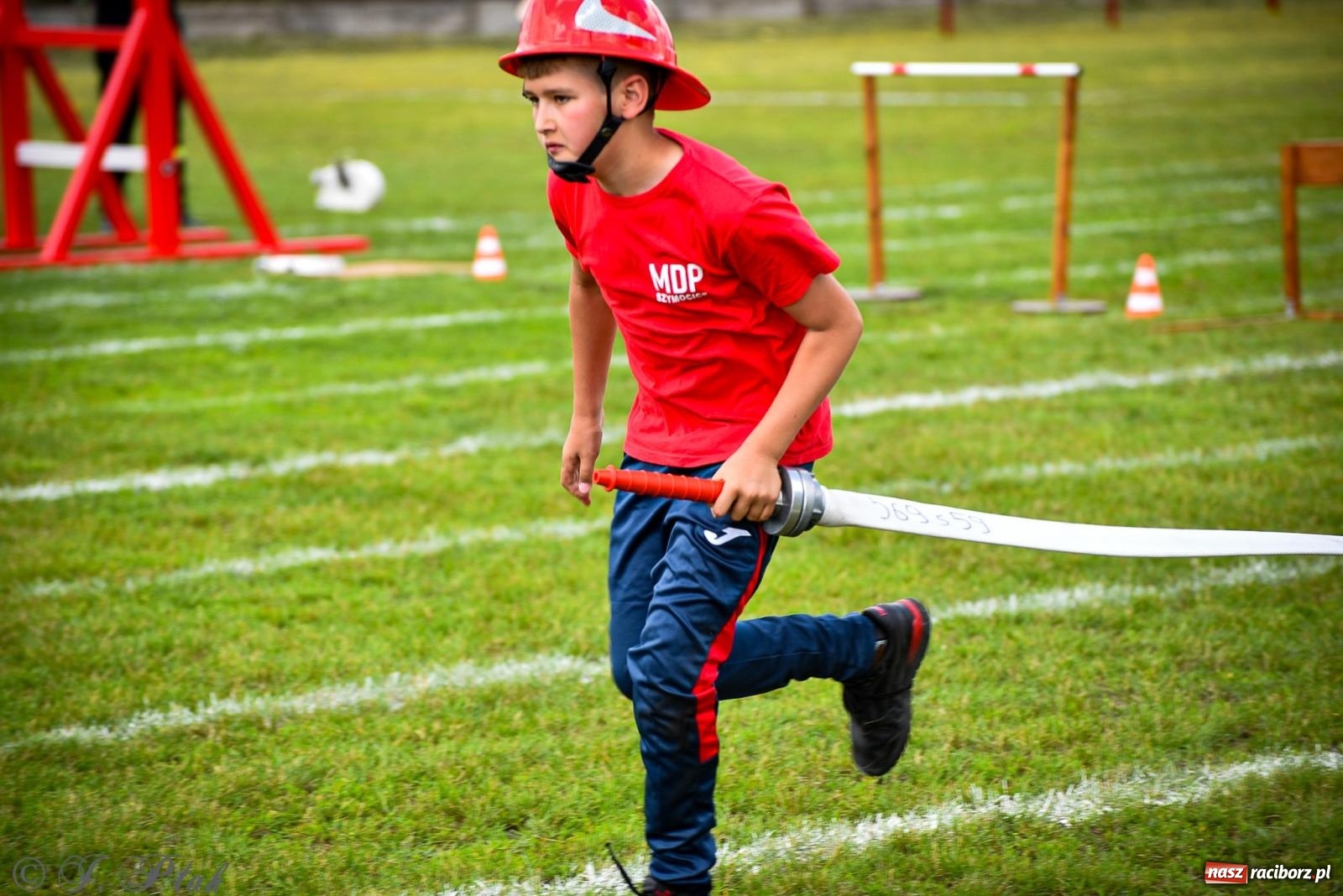 Zdjęcie w galerii na portalu naszraciborz.pl: Zawody sportowo-pożarnicze w Górkach Śląskich. Strażacka rywalizacja mimo kapryśnej pogody wiadomości z regionu