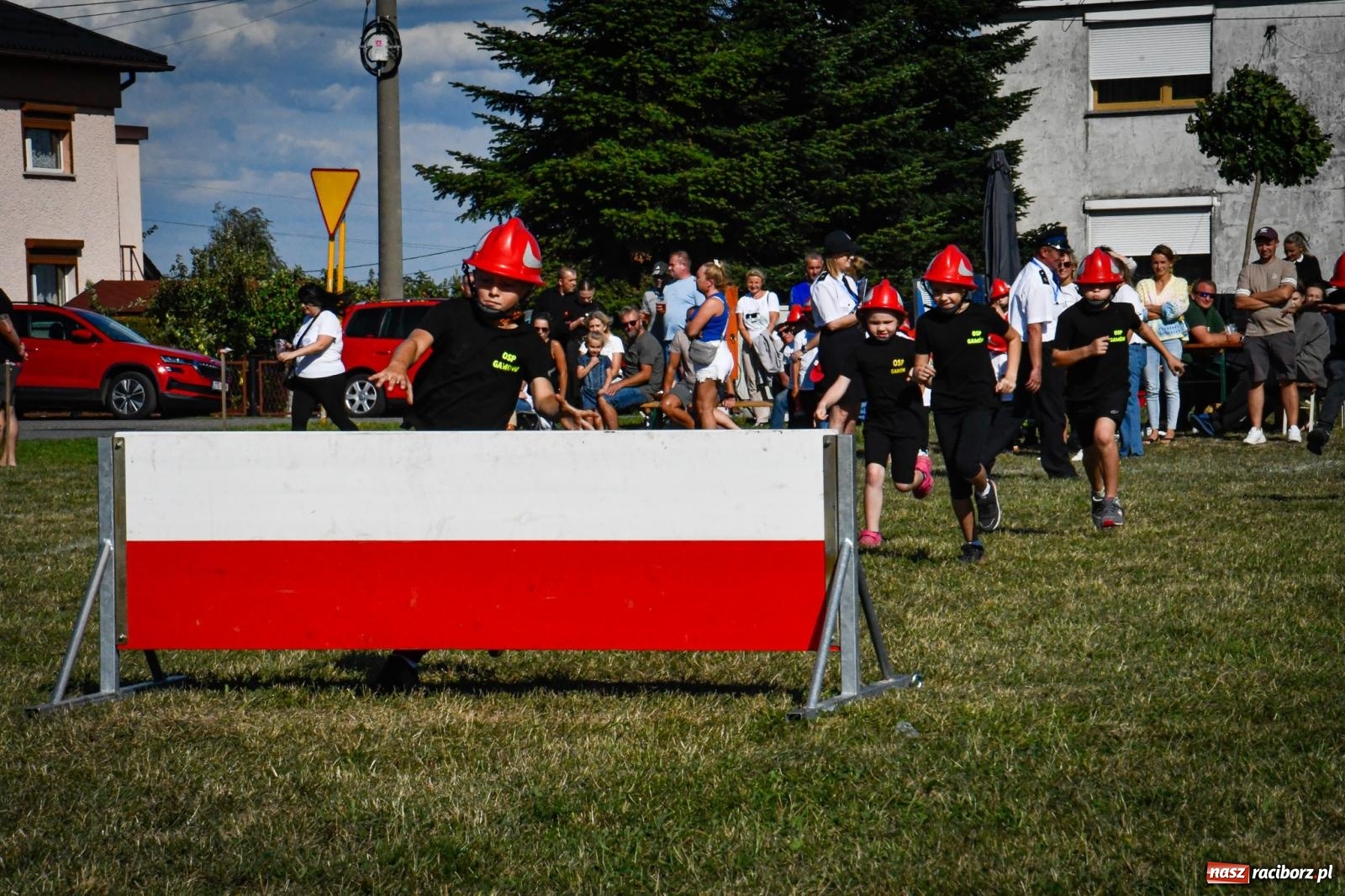 Zdjęcie w galerii na portalu naszraciborz.pl: Gospodarze, Gamów i Rudnik triumfują w gminnych zawodach sportowo-pożarniczych w Sławikowie [FOTO i WIDEO] wiadomości z regionu