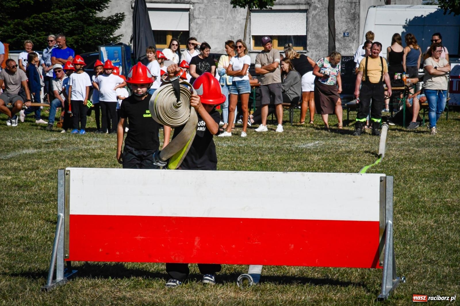 Zdjęcie w galerii na portalu naszraciborz.pl: Gospodarze, Gamów i Rudnik triumfują w gminnych zawodach sportowo-pożarniczych w Sławikowie [FOTO i WIDEO] wiadomości z regionu