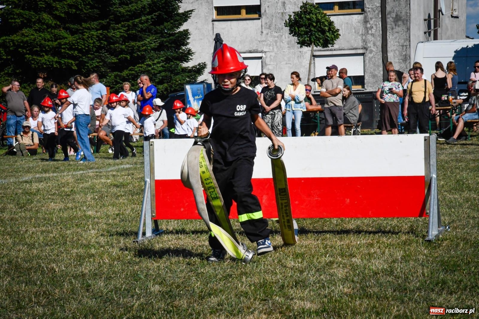 Zdjęcie w galerii na portalu naszraciborz.pl: Gospodarze, Gamów i Rudnik triumfują w gminnych zawodach sportowo-pożarniczych w Sławikowie [FOTO i WIDEO] wiadomości z regionu